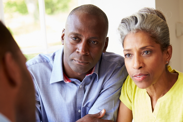 Mature Black Couple Meeting With Financial Advisor At Home