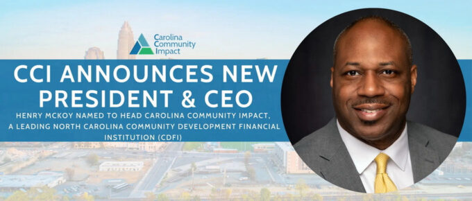 Announcement flyer: CCI announces new president and CEO" overlays on an image of downtown Raleigh and beside the photo of Dr. McKoy, a middle-aged man wearing a gray suit with white shirt and yellow tie